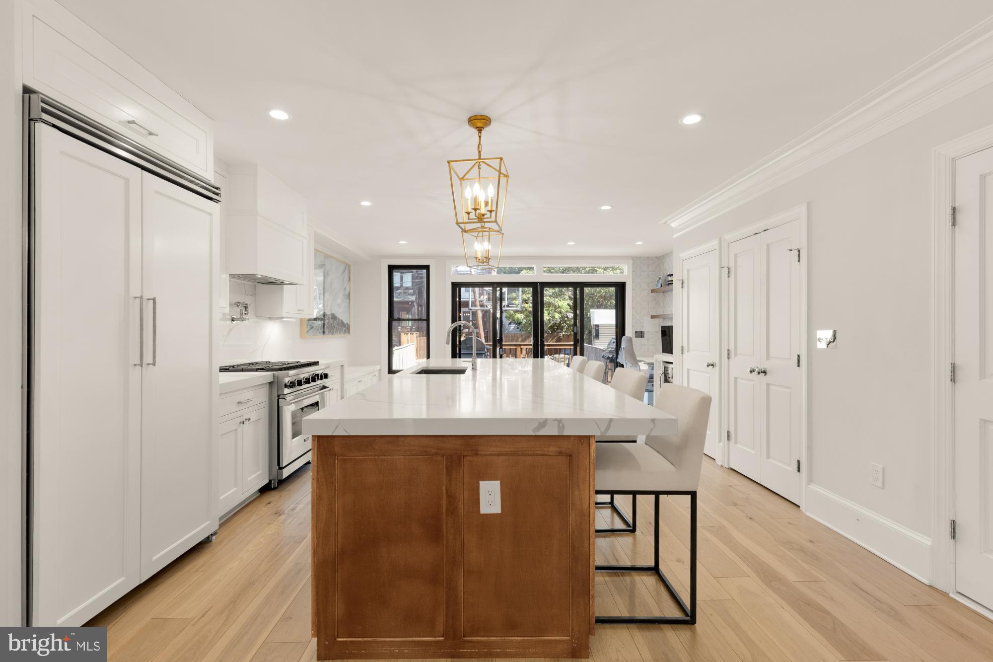 3705 Reservoir Road Northwest Washington, DC 20007 - Photo 12 of 45 a view of a kitchen with kitchen island a counter top space a sink stainless steel appliances and cabinets