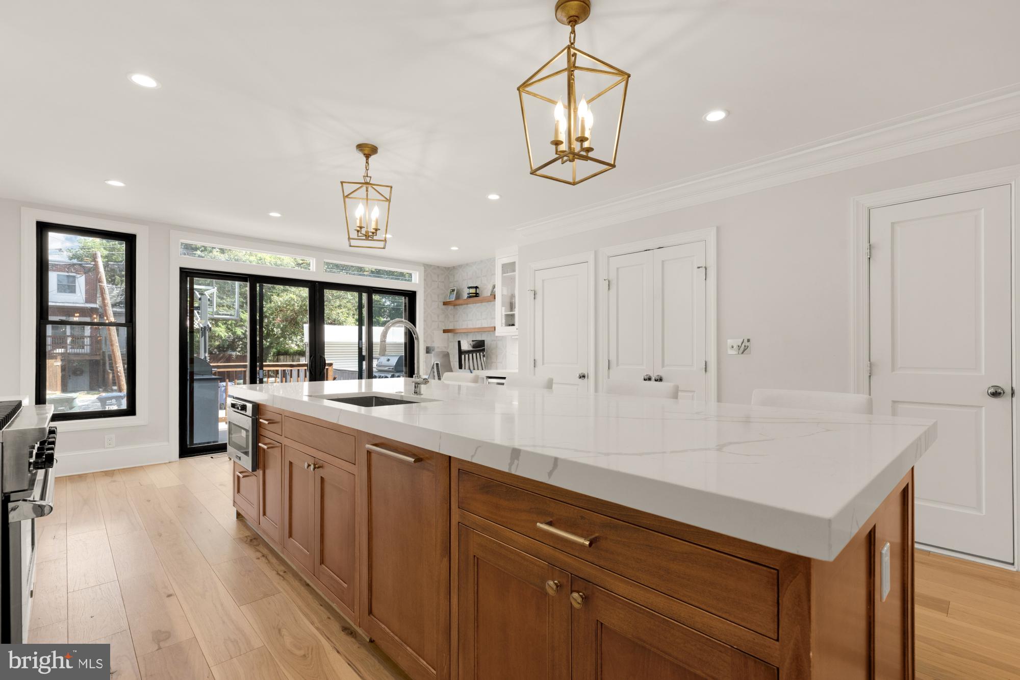 3705 Reservoir Road Northwest Washington, DC 20007 - Photo 14 of 45 a large kitchen with granite countertop a large counter top and stainless steel appliances
