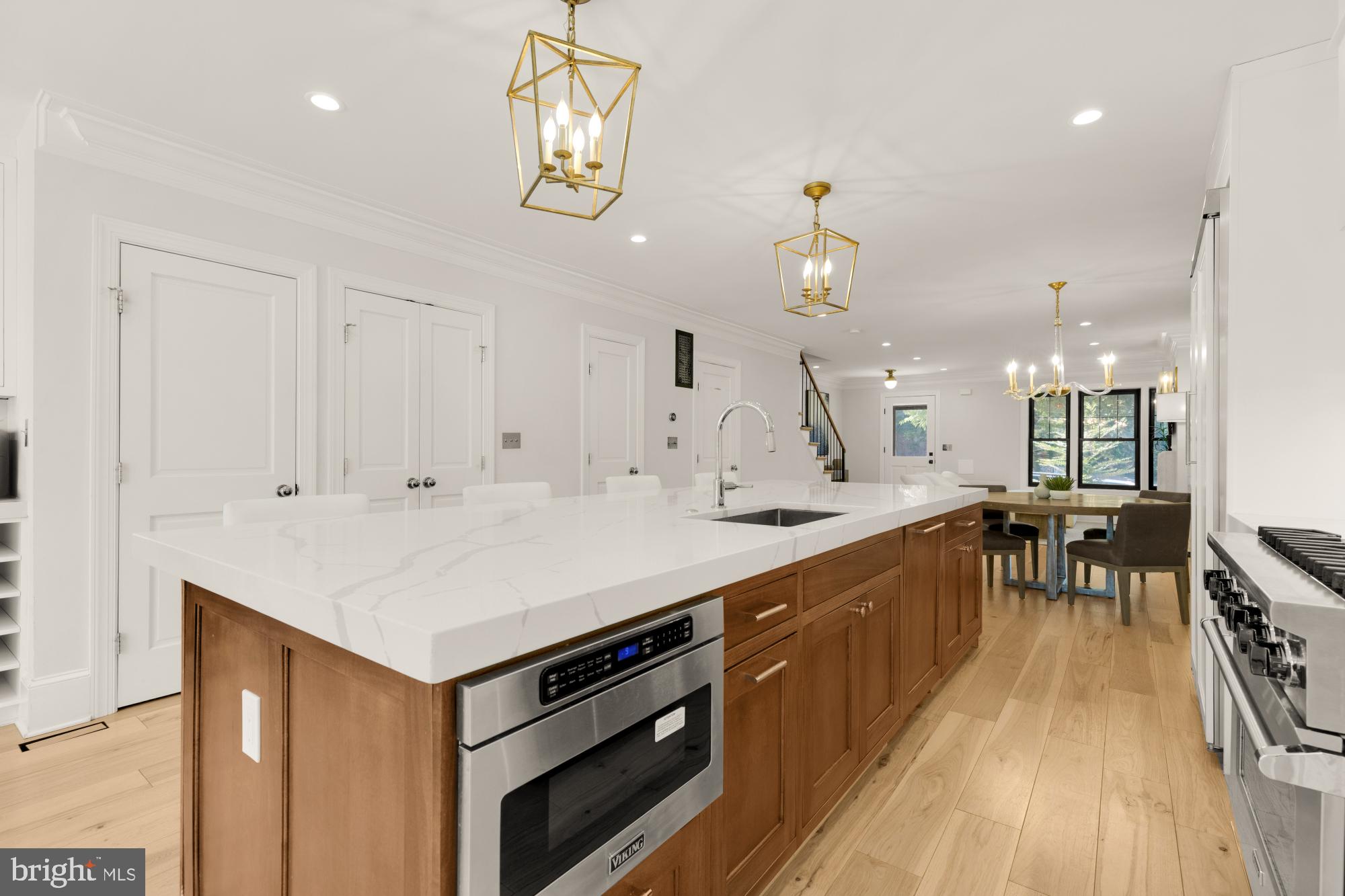3705 Reservoir Road Northwest Washington, DC 20007 - Photo 15 of 45 a kitchen with a sink a stove and chairs