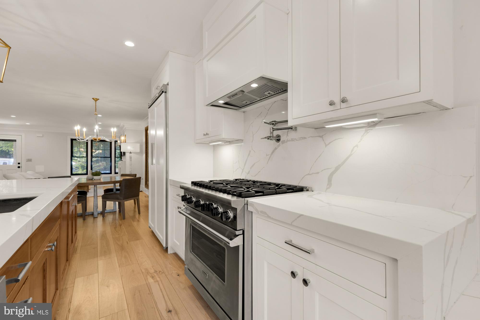 3705 Reservoir Road Northwest Washington, DC 20007 - Photo 17 of 45 a kitchen with a stove a sink and wooden floor