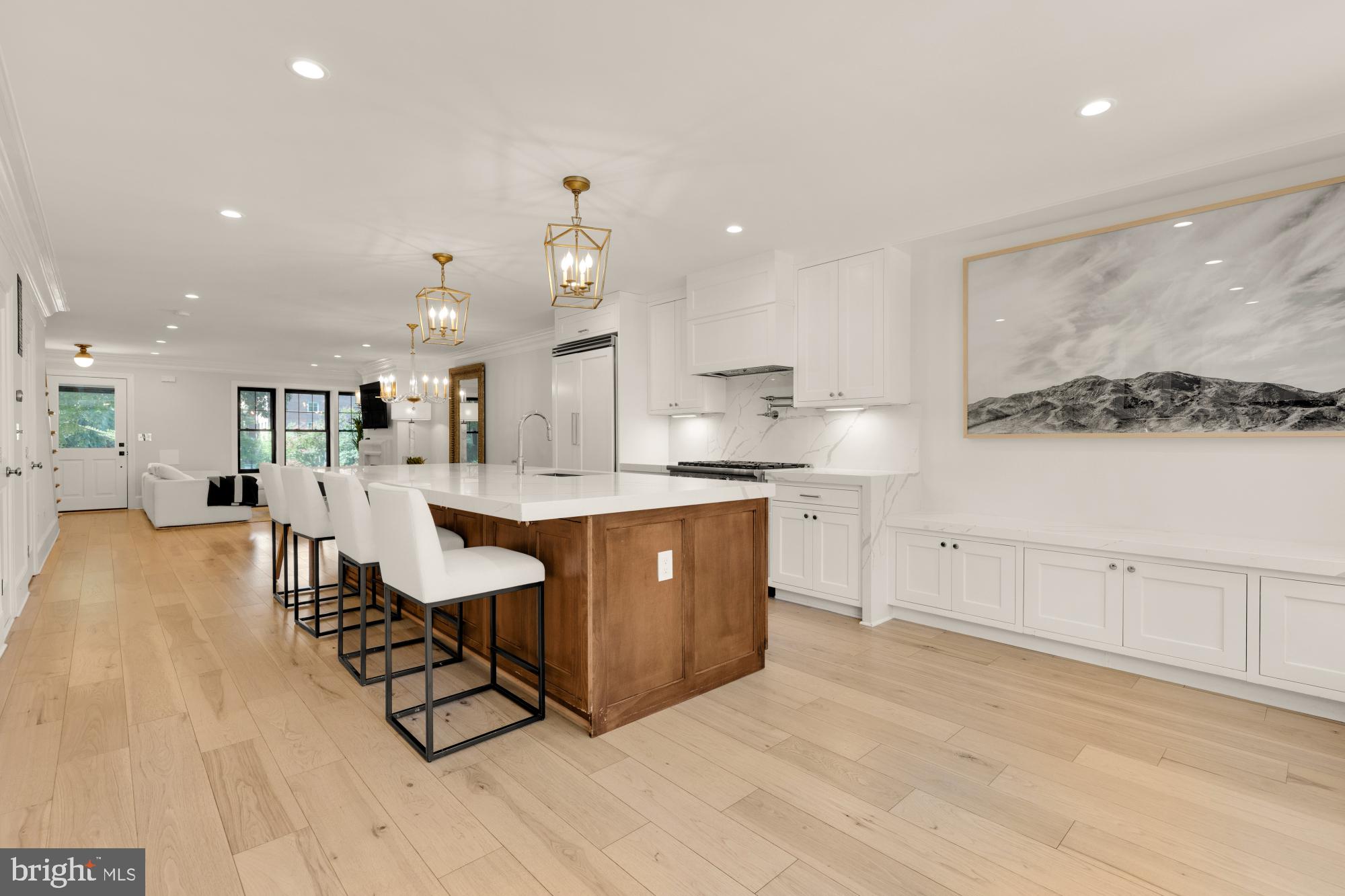 3705 Reservoir Road Northwest Washington, DC 20007 - Photo 20 of 45 a large kitchen with kitchen island a sink a stove a dining table and chairs