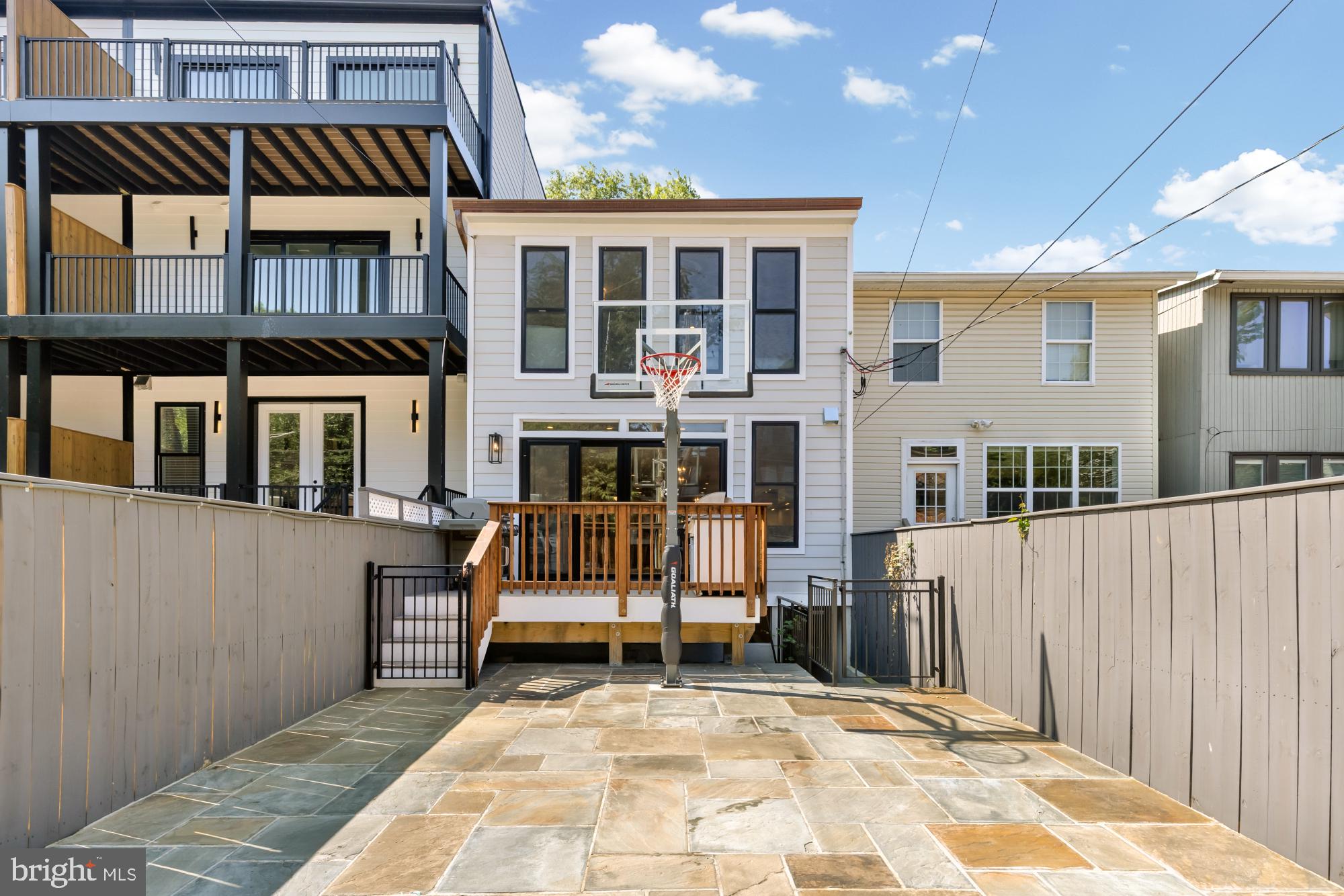 3705 Reservoir Road Northwest Washington, DC 20007 - Photo 22 of 45 a view of a house with wooden floor and a yard