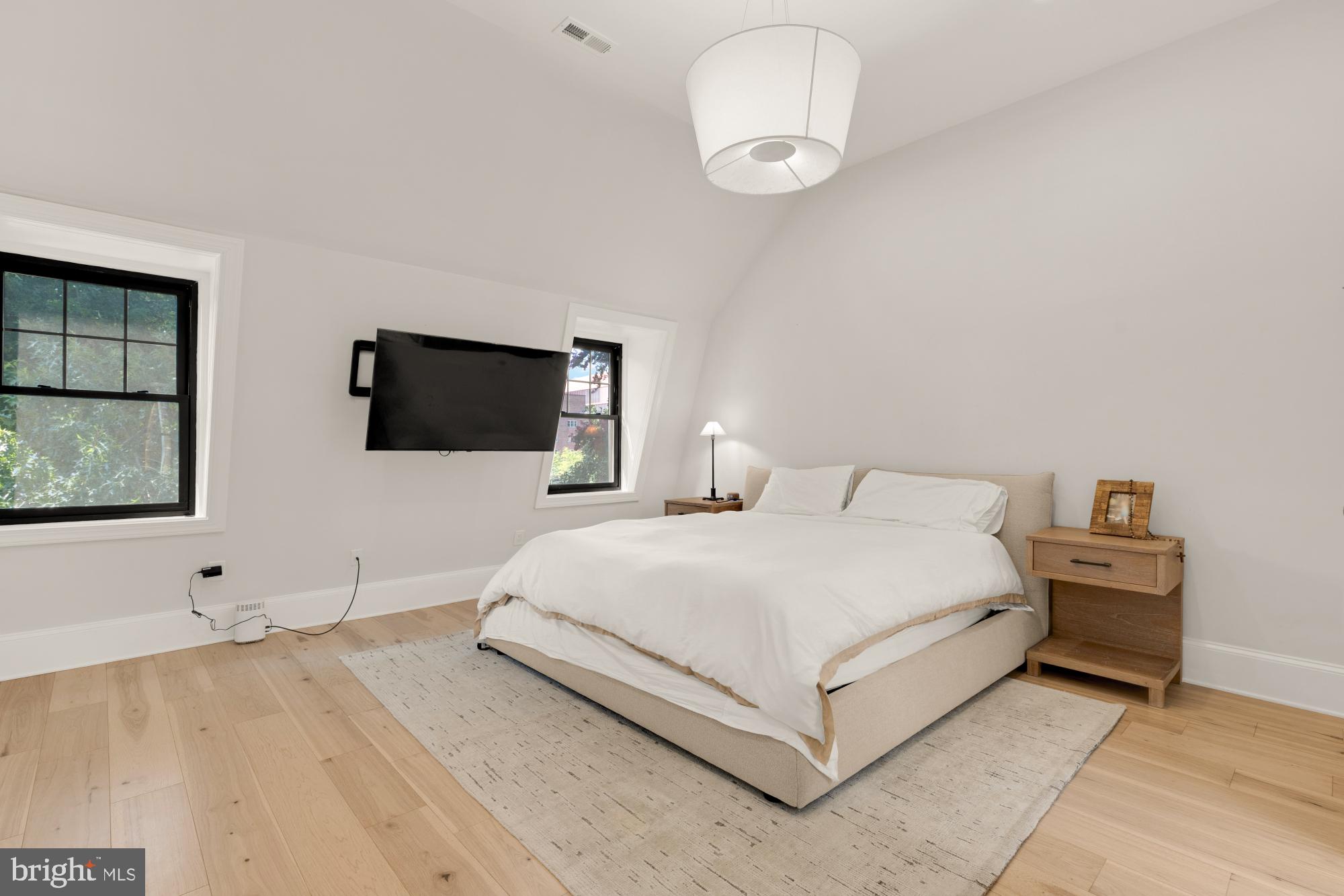 3705 Reservoir Road Northwest Washington, DC 20007 - Photo 25 of 45 a bedroom with a bed and a flat screen tv