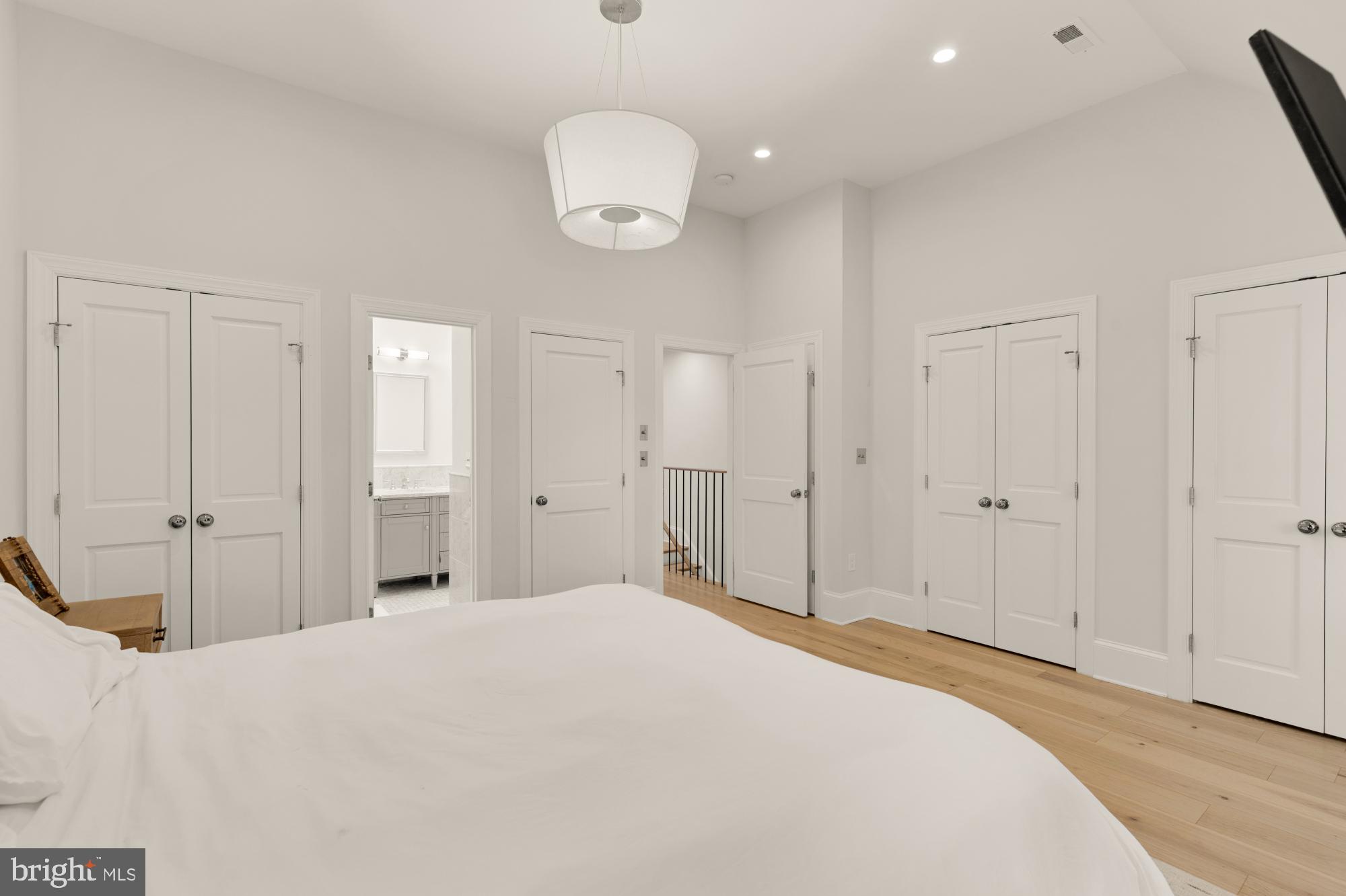 3705 Reservoir Road Northwest Washington, DC 20007 - Photo 27 of 45 a spacious bedroom with a bed and cabinets