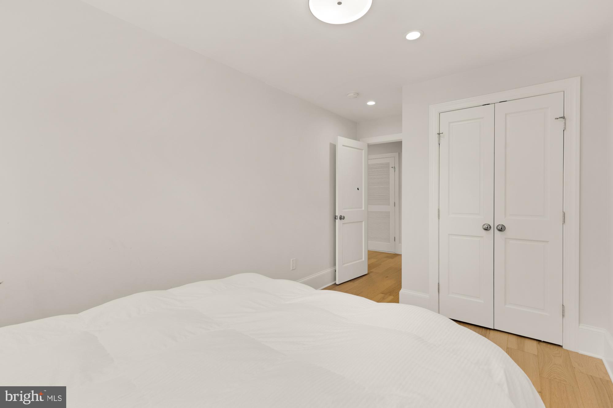 3705 Reservoir Road Northwest Washington, DC 20007 - Photo 32 of 45 a bedroom with a bed and a cabinet