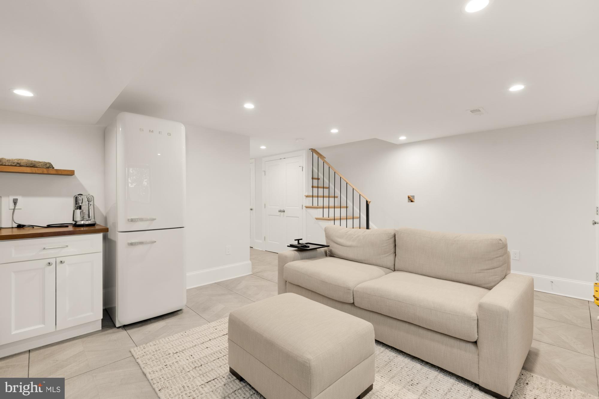 3705 Reservoir Road Northwest Washington, DC 20007 - Photo 38 of 45 a living room with furniture and a refrigerator