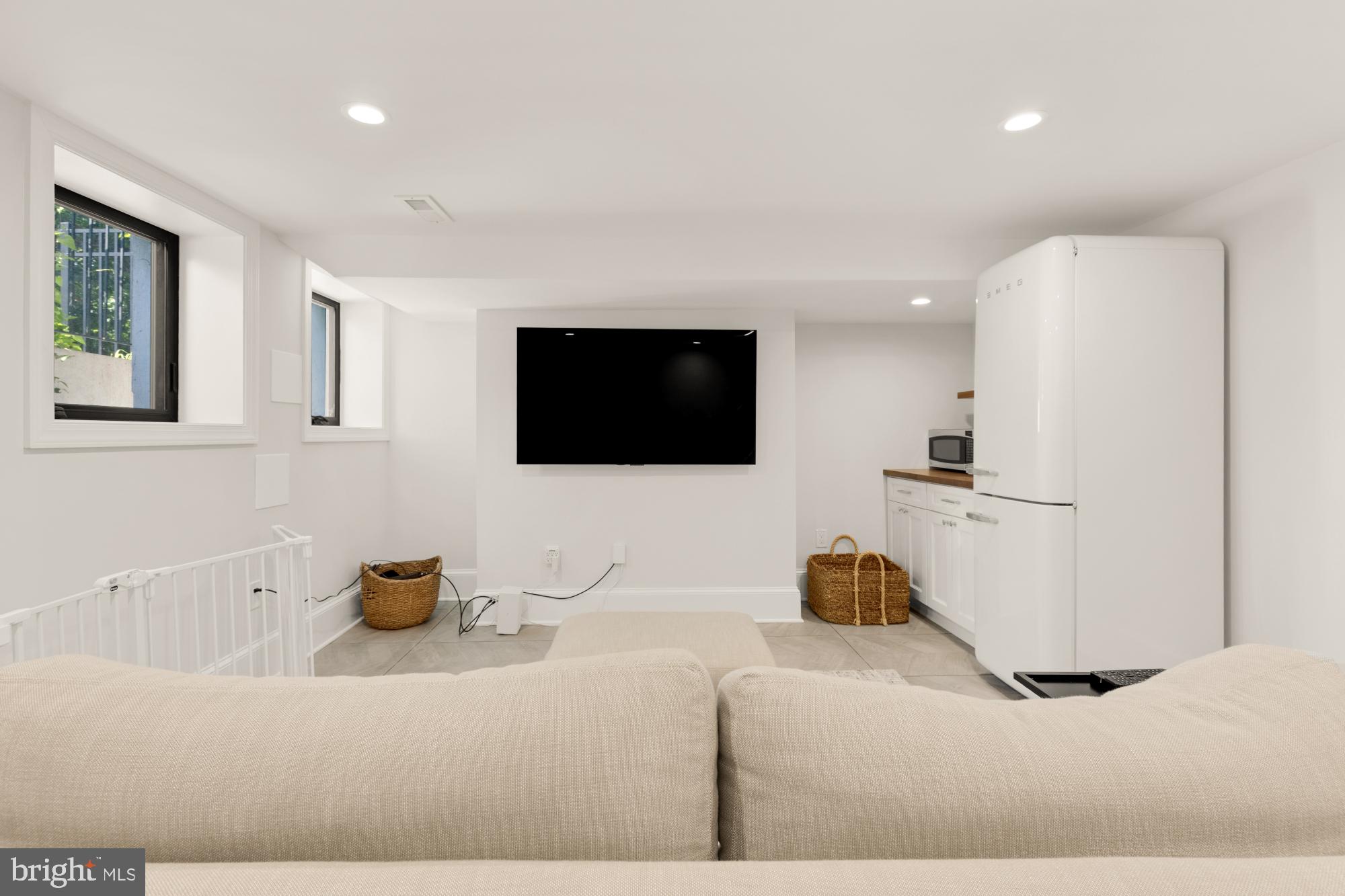 3705 Reservoir Road Northwest Washington, DC 20007 - Photo 39 of 45 a living room with a flat screen tv and a lamp