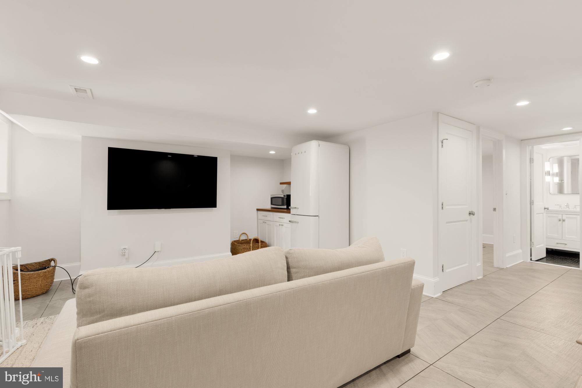 3705 Reservoir Road Northwest Washington, DC 20007 - Photo 41 of 45 a living room with furniture and a flat screen tv