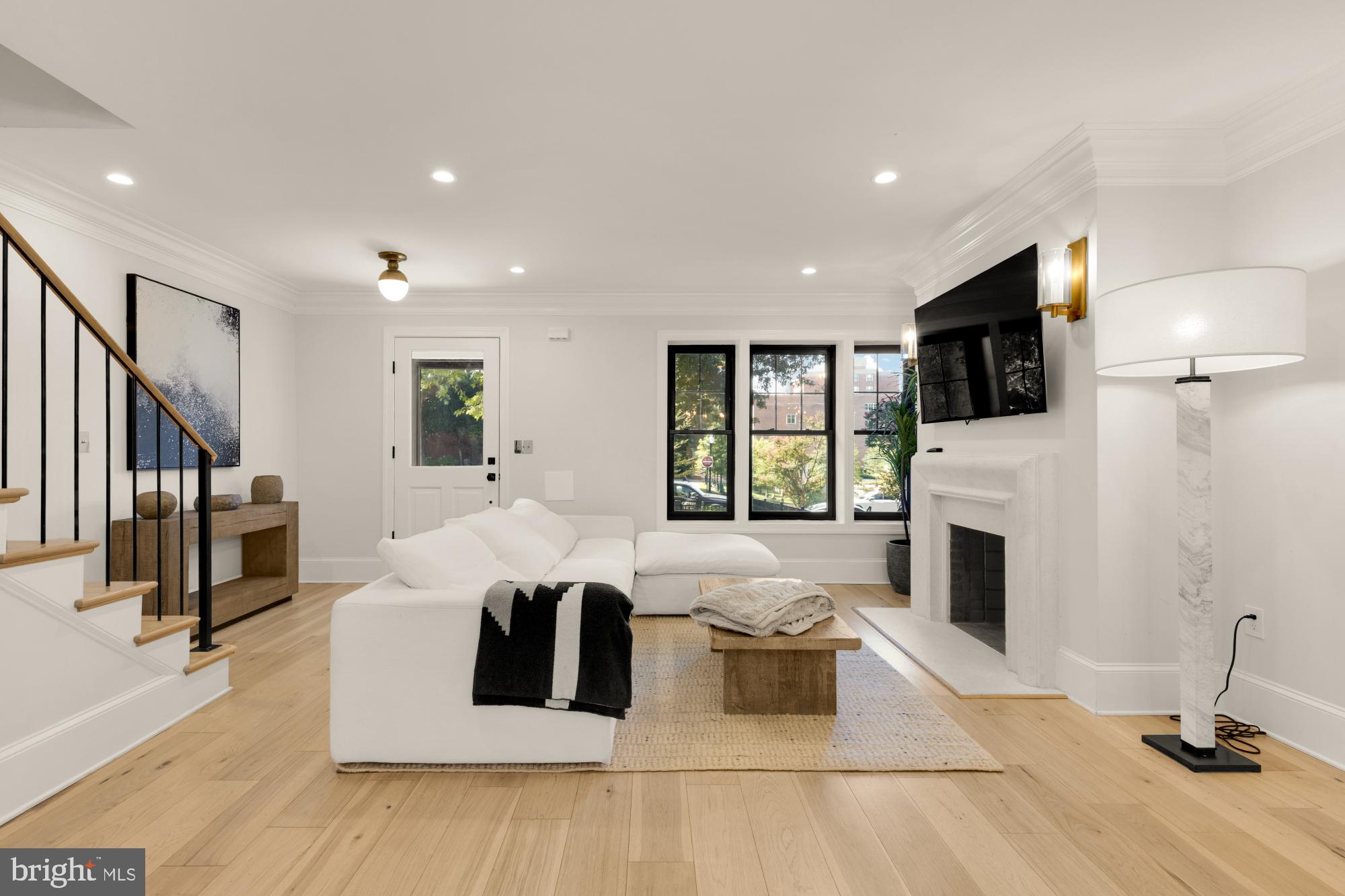 3705 Reservoir Road Northwest Washington, DC 20007 - Photo 5 of 45 a living room with fireplace furniture and a flat screen tv