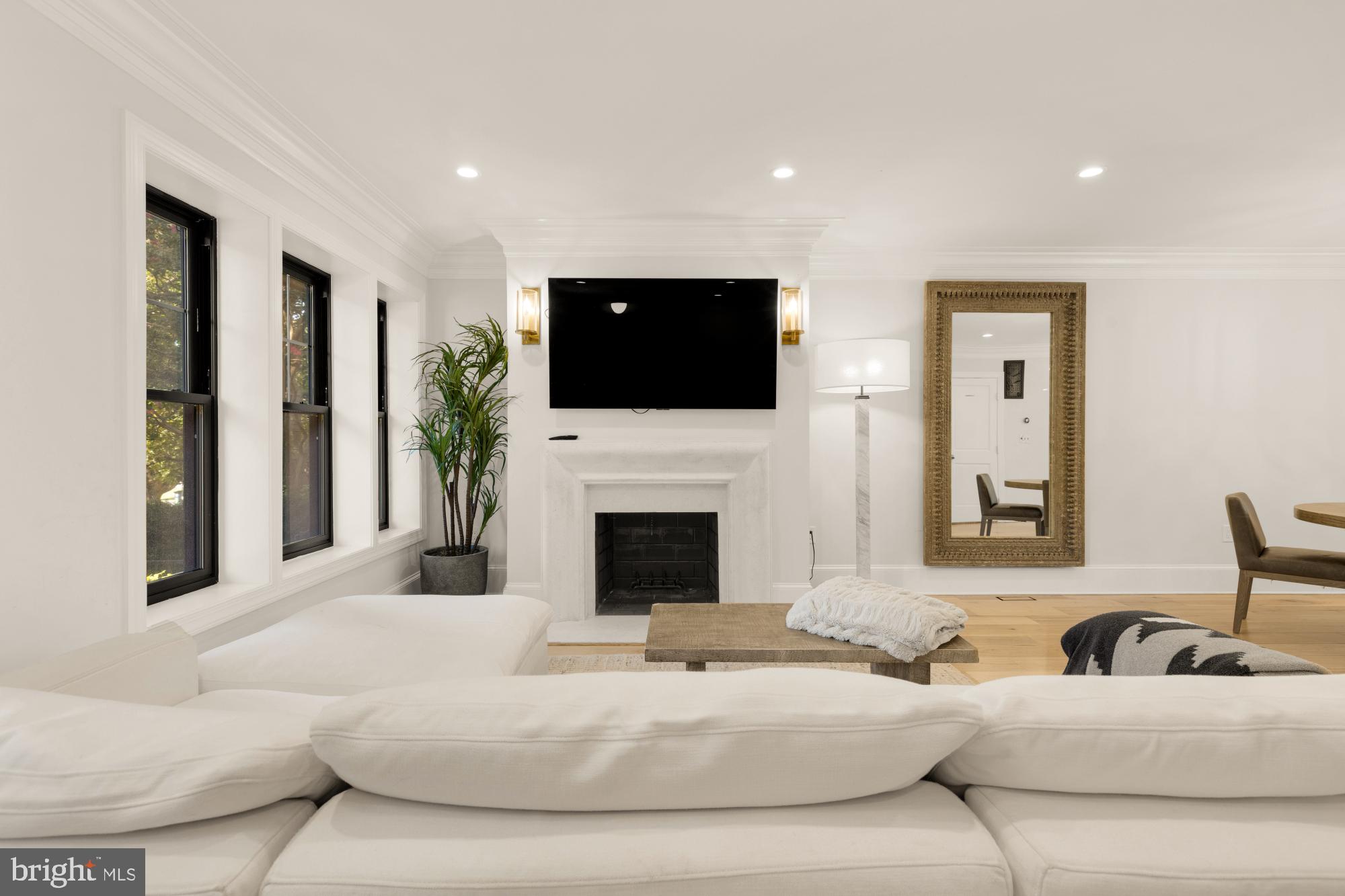 3705 Reservoir Road Northwest Washington, DC 20007 - Photo 6 of 45 a living room with fireplace furniture and a flat screen tv