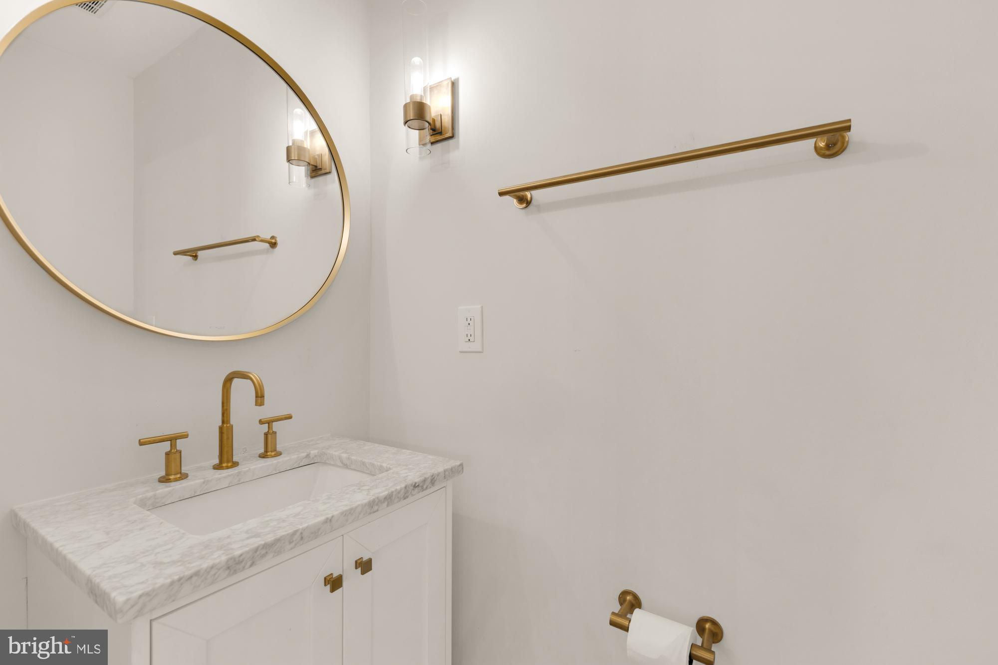3705 Reservoir Road Northwest Washington, DC 20007 - Photo 10 of 45 a bathroom with a sink and mirror