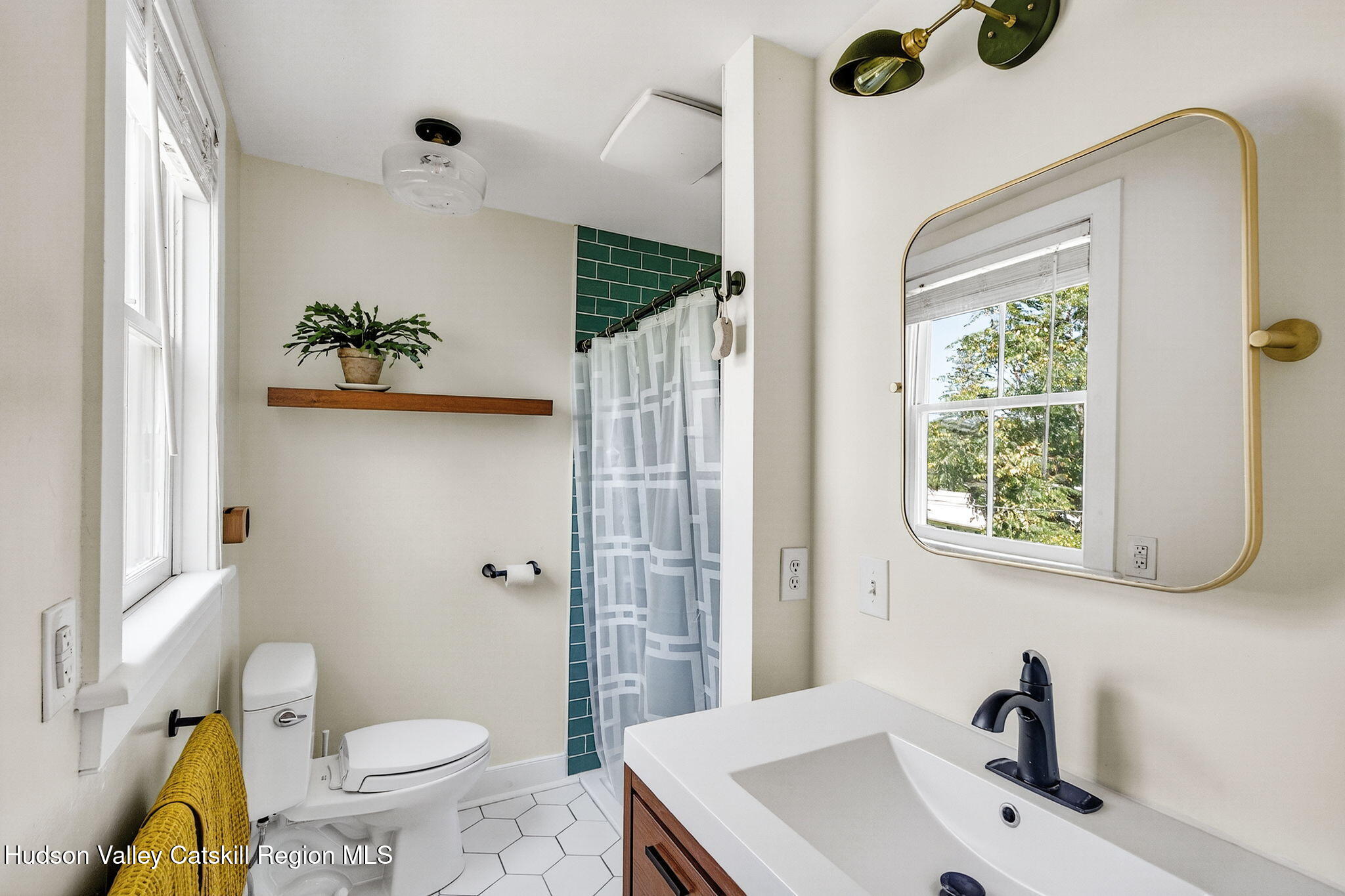 31 Church Street Red Hook, NY 12571 - Photo 12 of 20 a bathroom with a sink toilet and shower
