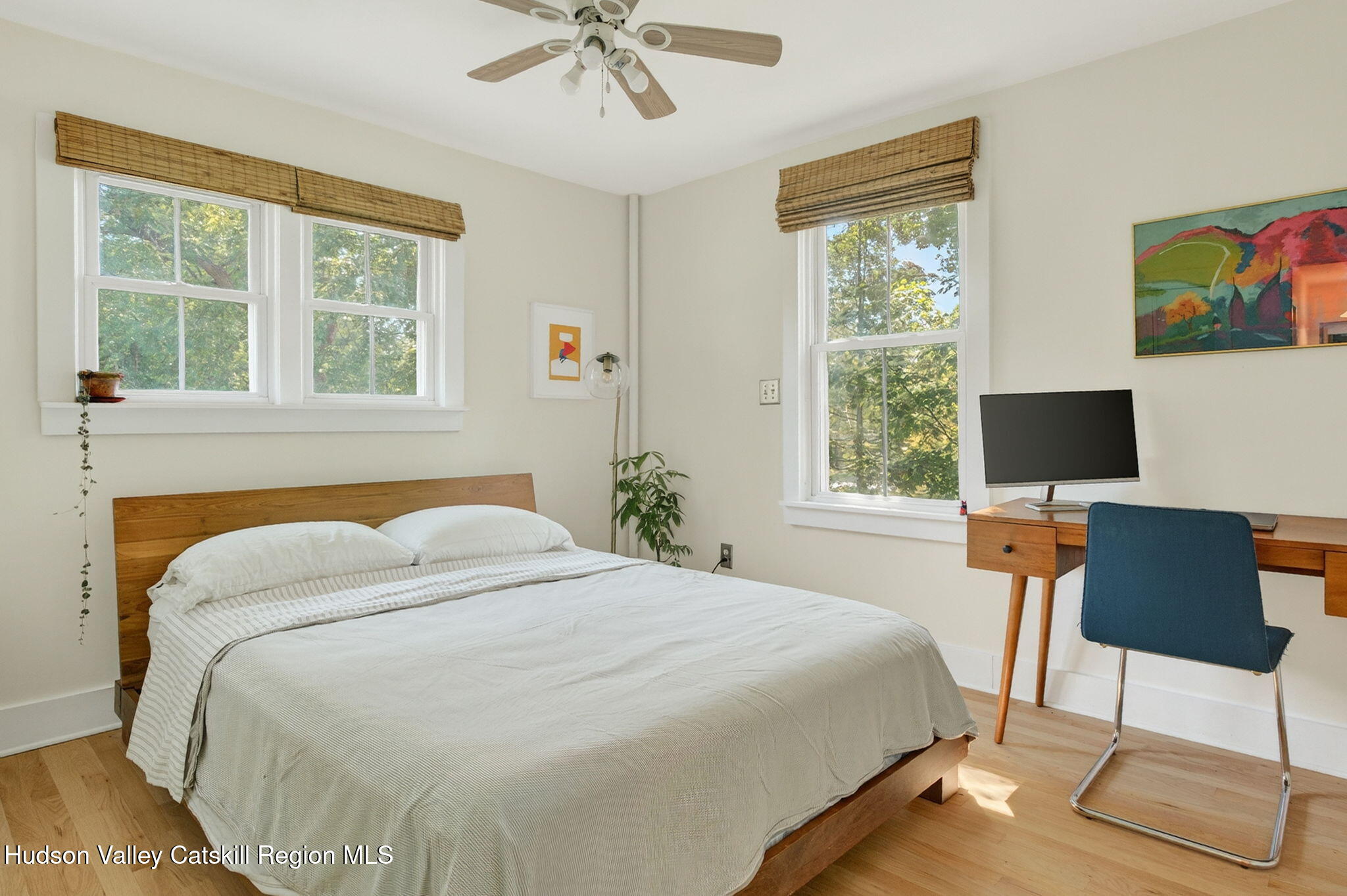 31 Church Street Red Hook, NY 12571 - Photo 13 of 20 a bedroom with a bed and chair with outer view