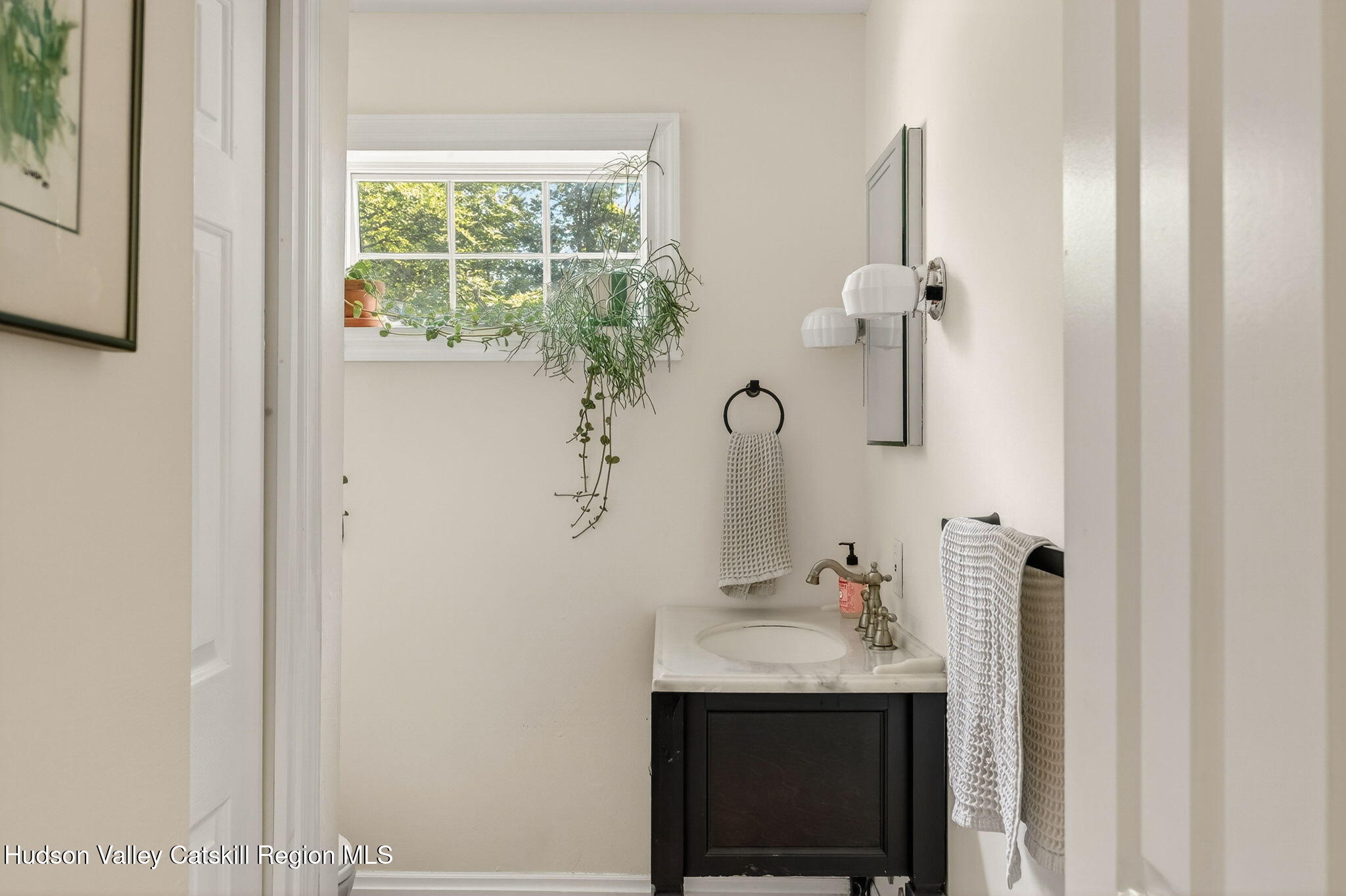 31 Church Street Red Hook, NY 12571 - Photo 7 of 20 a bathroom with a sink and mirror