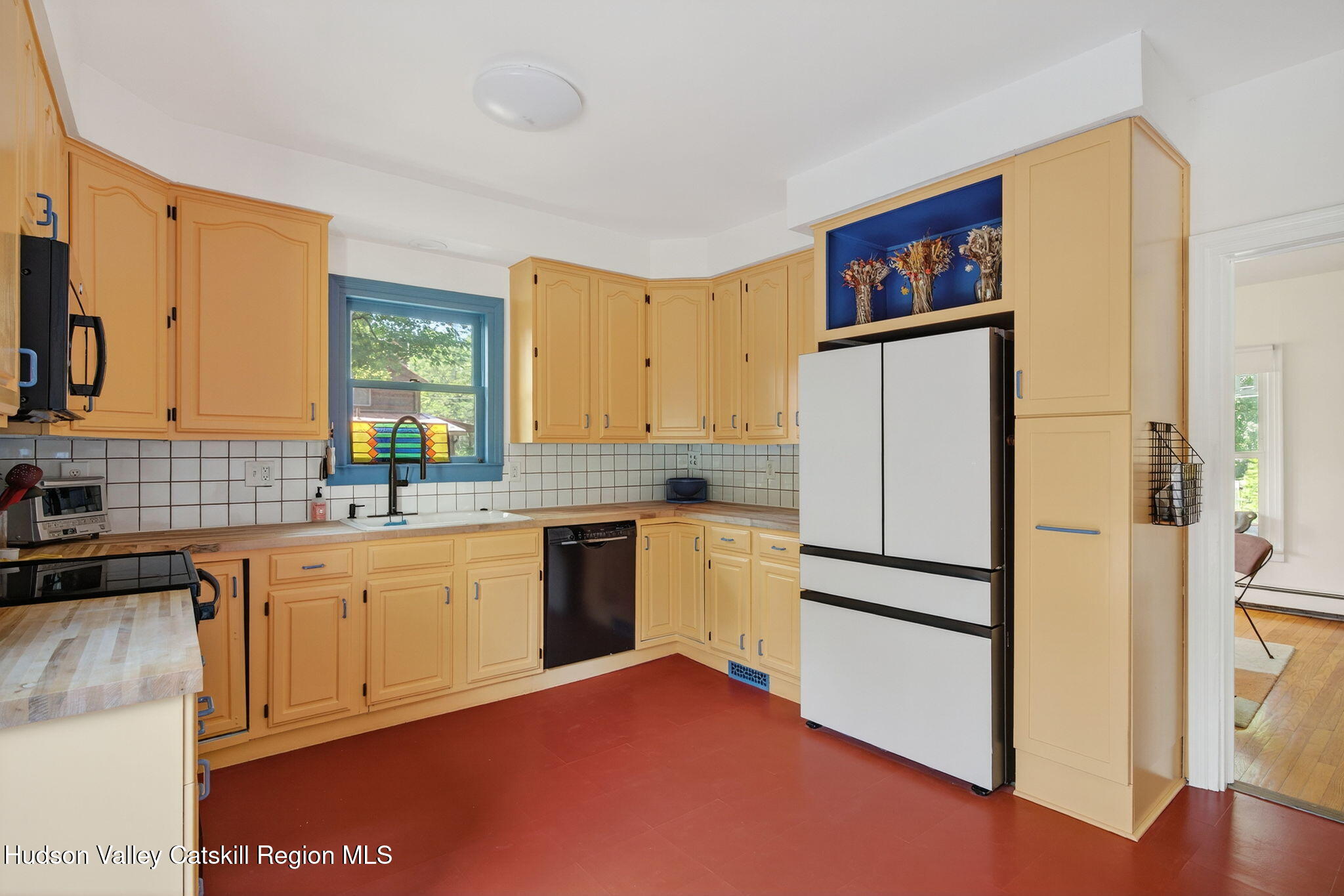 31 Church Street Red Hook, NY 12571 - Photo 8 of 20 a kitchen with a refrigerator and a sink