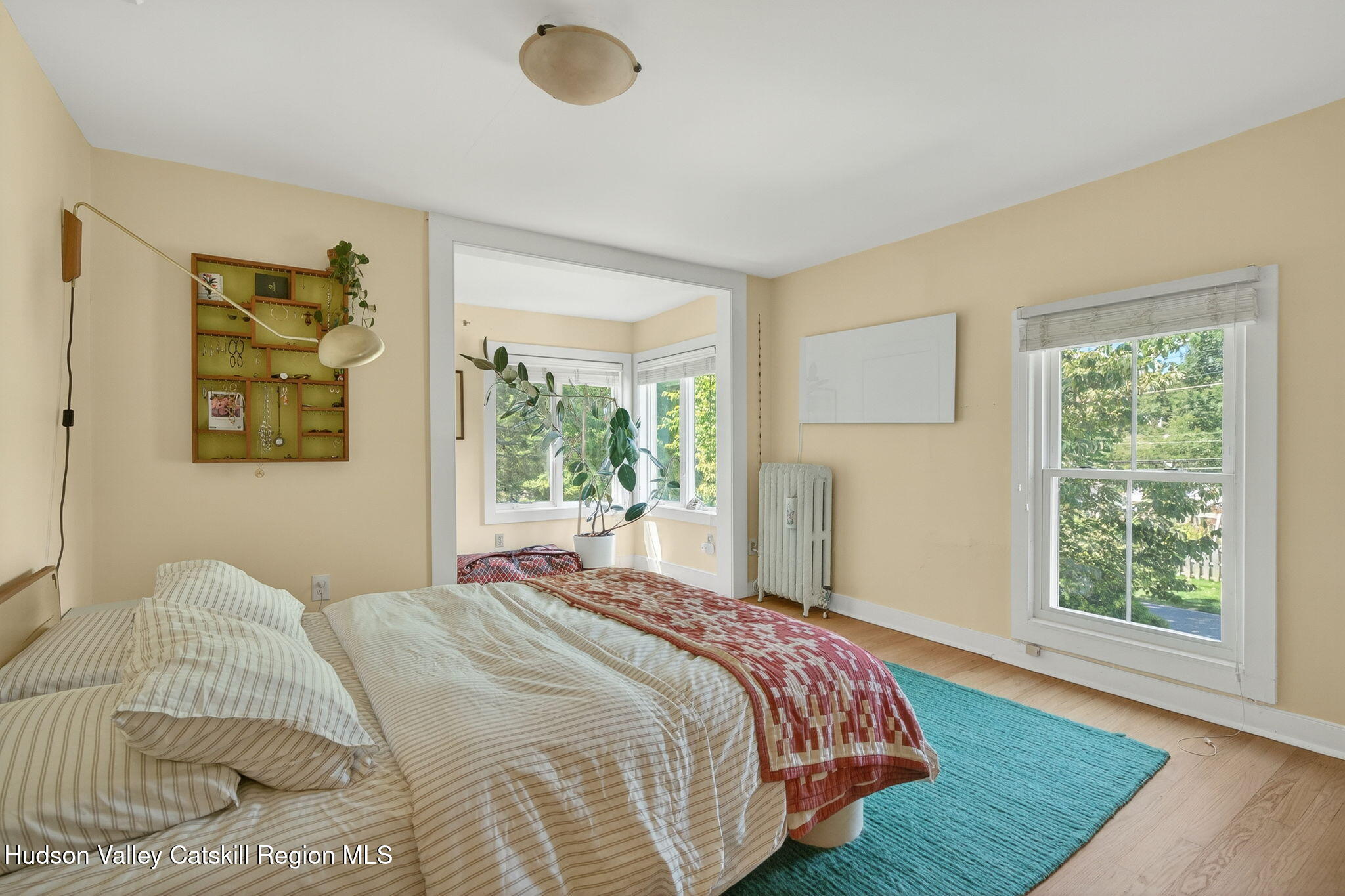 31 Church Street Red Hook, NY 12571 - Photo 10 of 20 a bedroom with a bed and a window