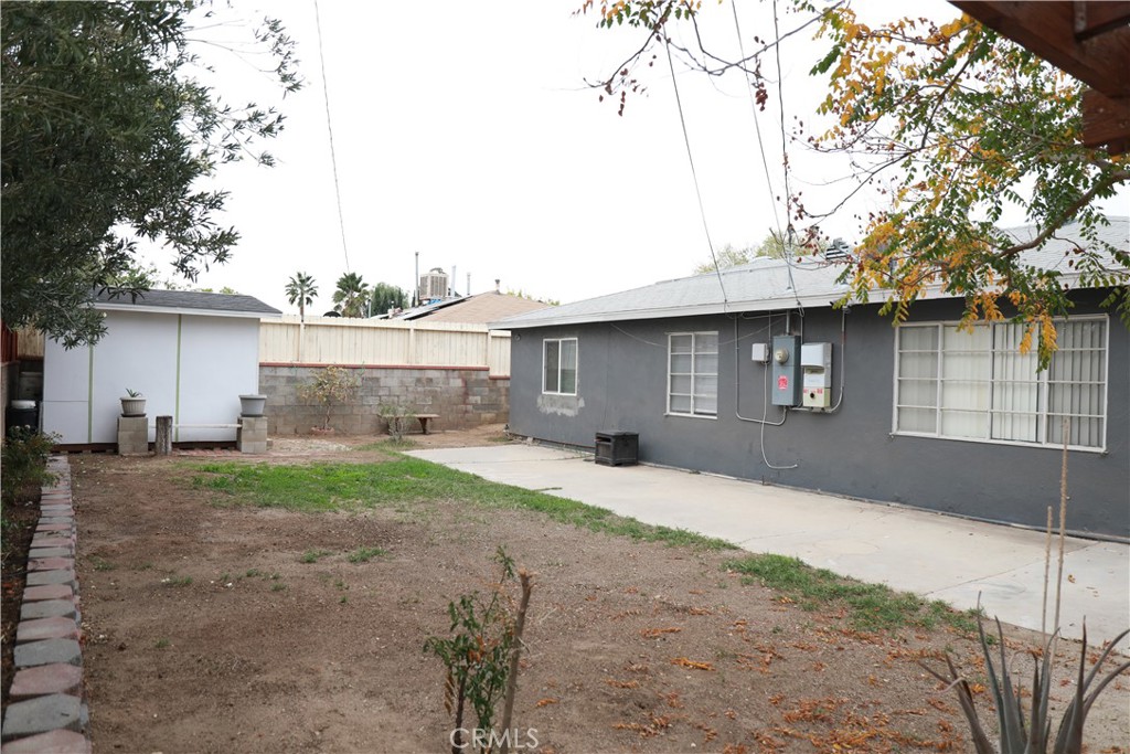 38626 Frontier Avenue Palmdale, CA 93550 - Photo 11 of 13 a front view of a house with a yard and garage