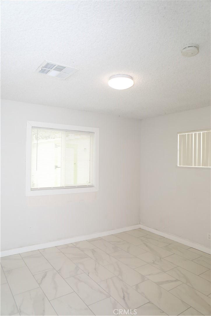 38626 Frontier Avenue Palmdale, CA 93550 - Photo 6 of 13 an empty room with a empty space and a window