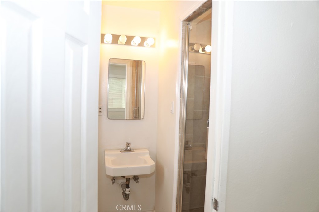 38626 Frontier Avenue Palmdale, CA 93550 - Photo 8 of 13 a bathroom with a sink and mirror