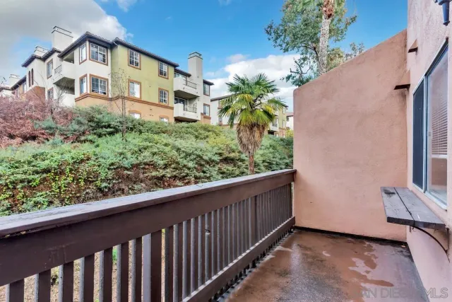 a view of a balcony with plants