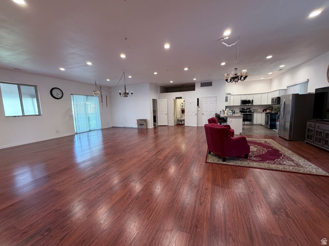 2855 South 1000 West Perry, UT 84302 - Photo 114 of 142 Living area with suspended lighting and dark wood finished floors