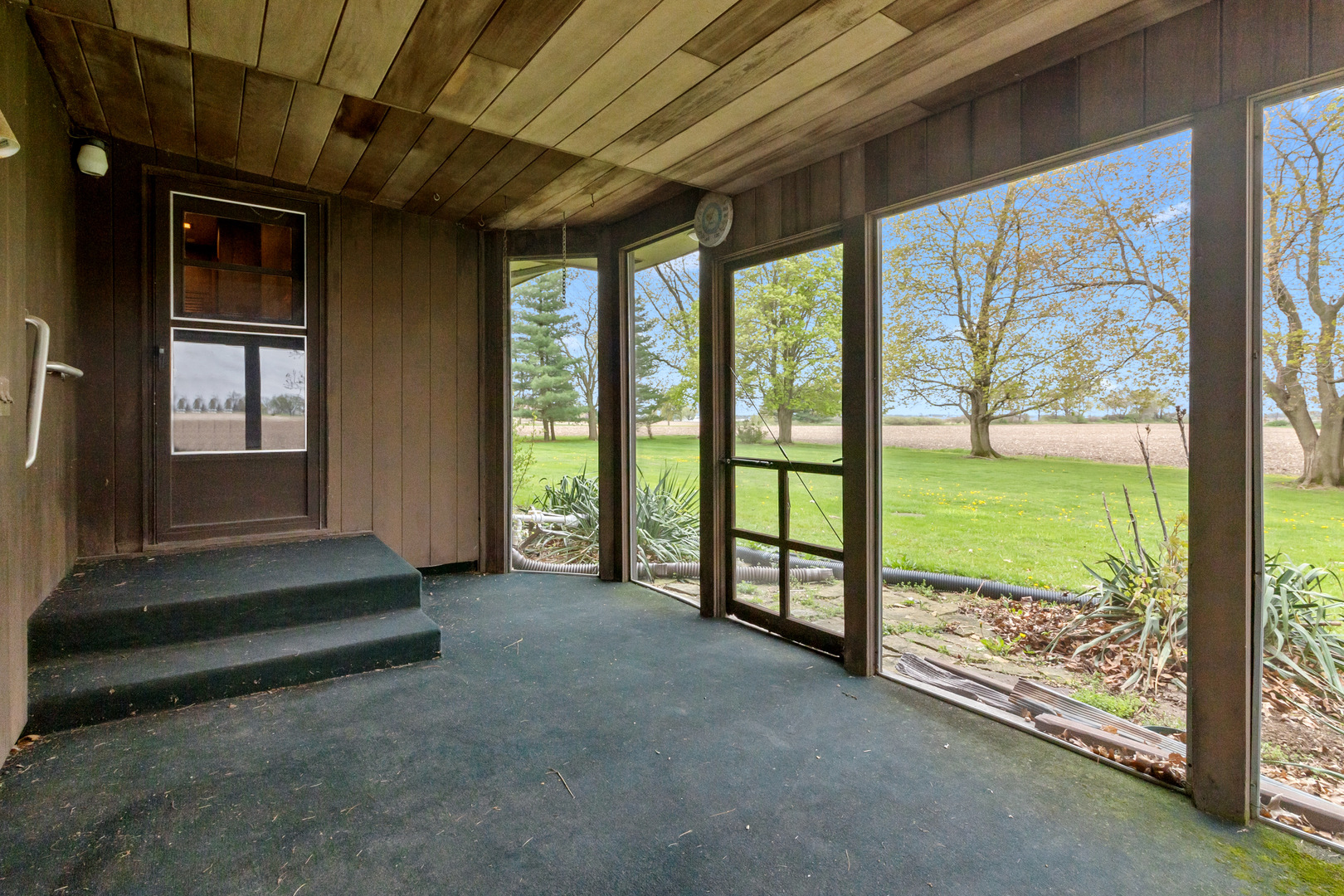 6907 White Oaks Road Harvard, IL 60033 - Photo 17 of 21 a view of room with floor to ceiling window and an outdoor space