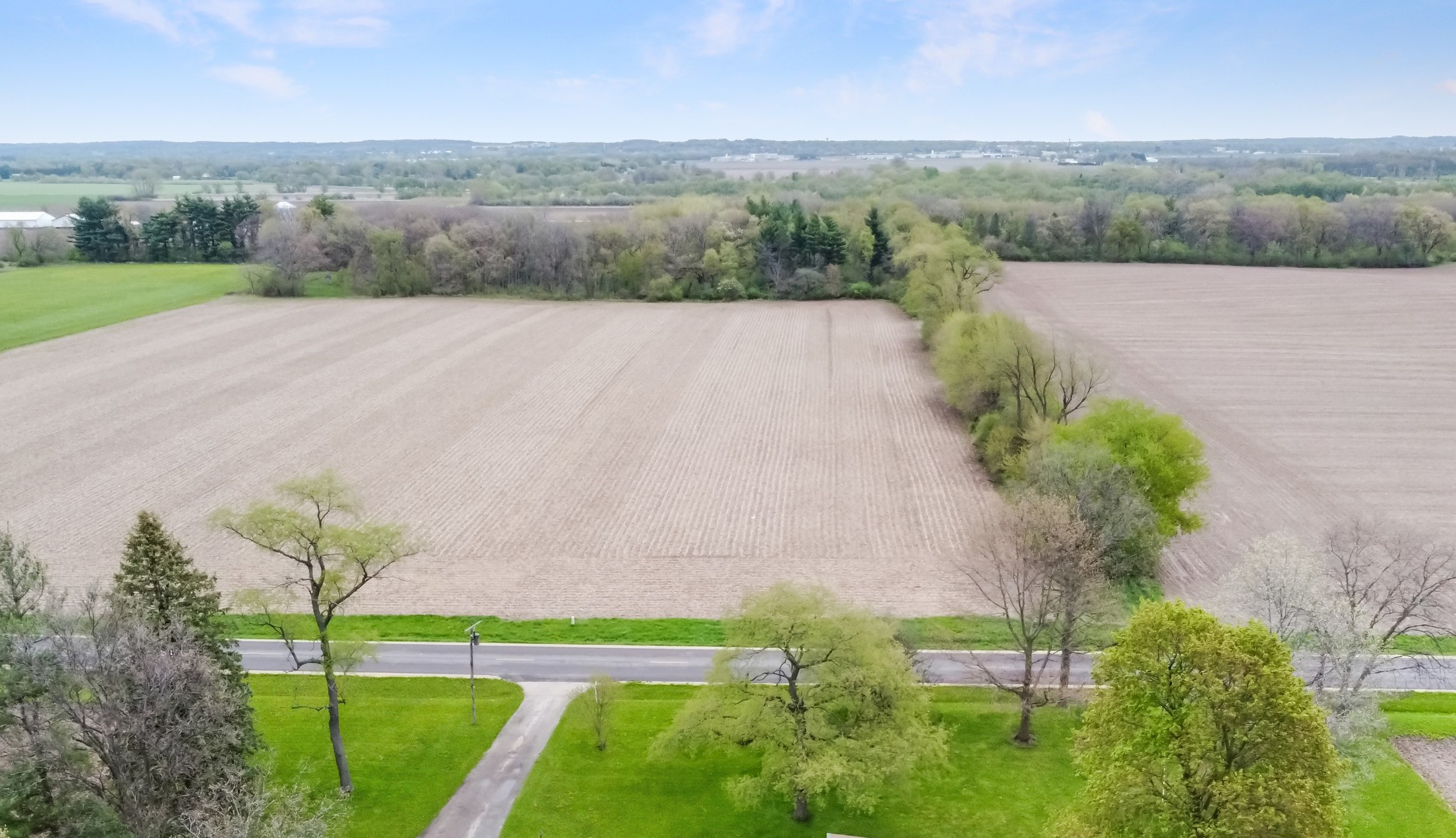 6907 White Oaks Road Harvard, IL 60033 - Photo 21 of 21 an aerial view of a golf course with a yard