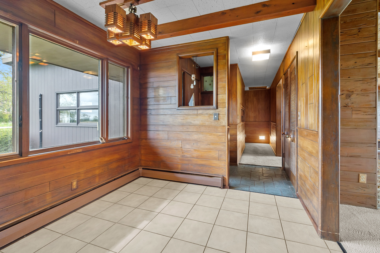 6907 White Oaks Road Harvard, IL 60033 - Photo 3 of 21 a view of a hallway with a chandelier and chandelier