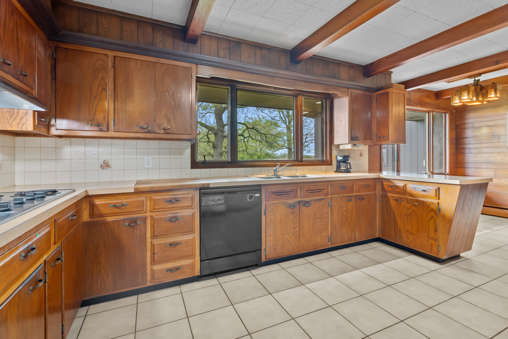 6907 White Oaks Road Harvard, IL 60033 - Photo 7 of 21 a kitchen with stainless steel appliances granite countertop a sink counter space cabinets and a large window