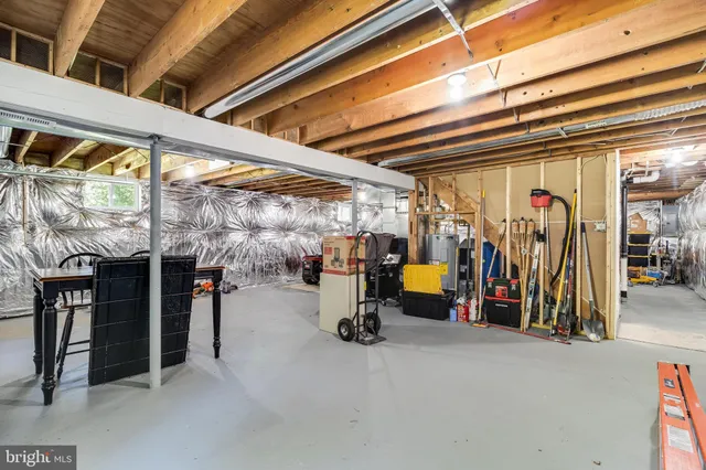 a view of a livingroom with furniture and a fireplace