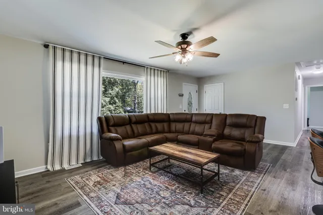 a living room with furniture and a rug