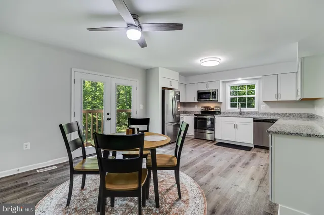 a dining room with furniture and window