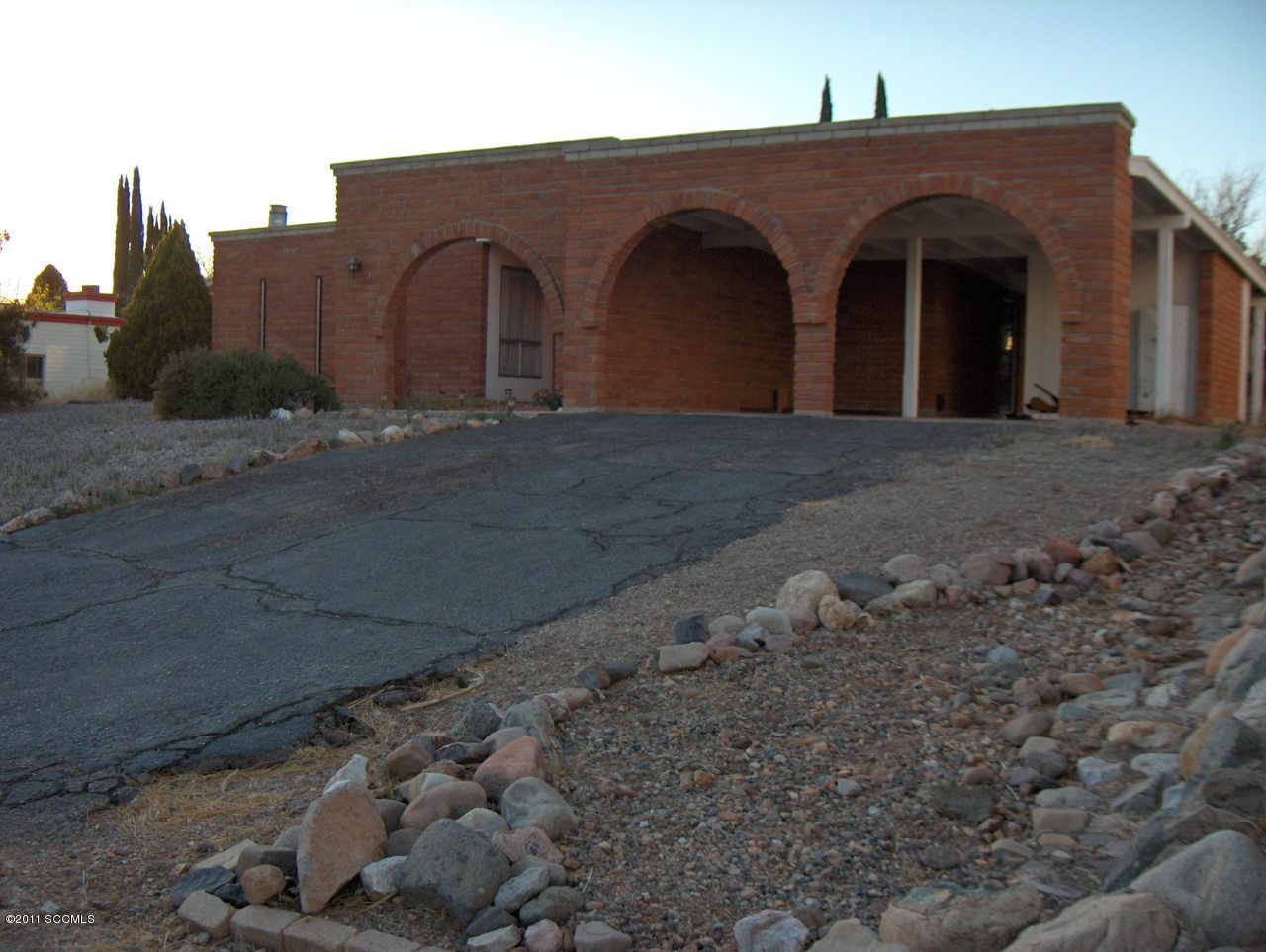398 Poston Street Rio Rico, AZ 85648 - Photo 1 of 10 a front view of a house with a yard