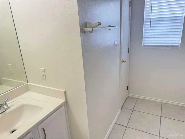 a bathroom with a sink and vanity