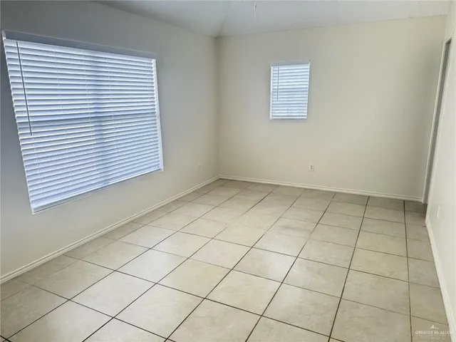 an empty room with a white cabinet door