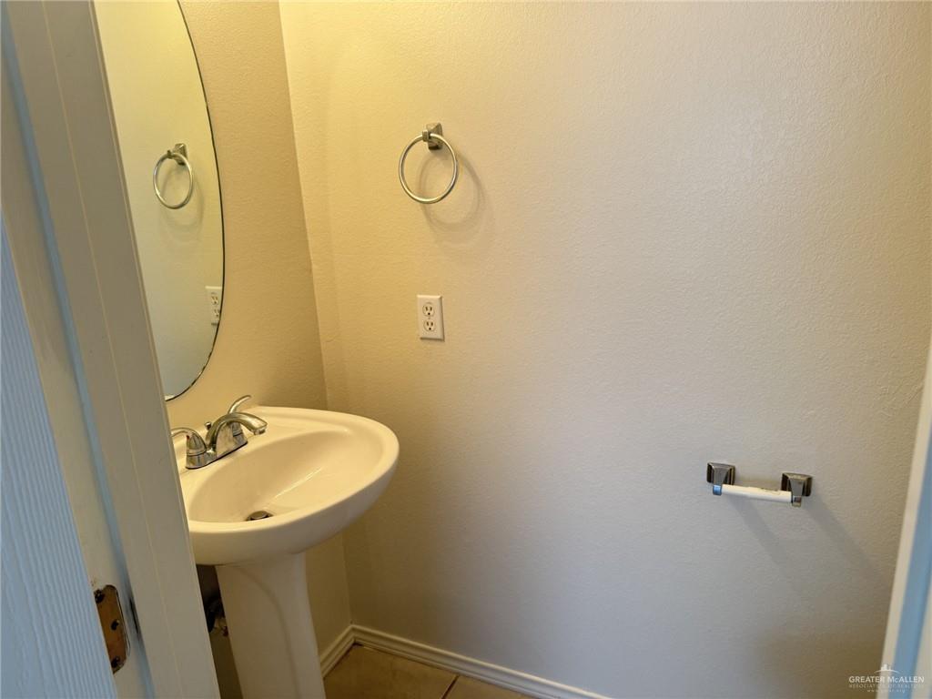 3414 Santa Rocio Mission, TX 78572 - Photo 15 of 19 a bathroom with a sink and mirror