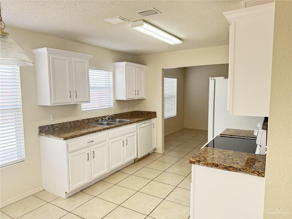 3414 Santa Rocio Mission, TX 78572 - Photo 3 of 19 a kitchen with granite countertop cabinets and window