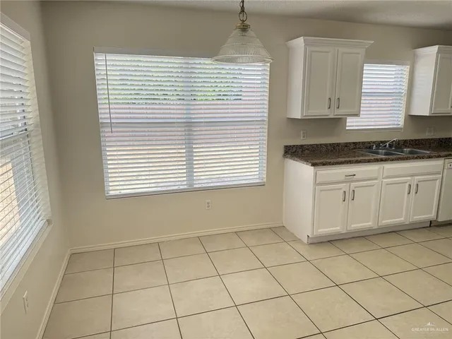 a view of a kitchen with a sink