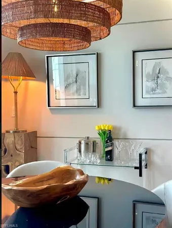 a bathroom with a sink a mirror and next to a window