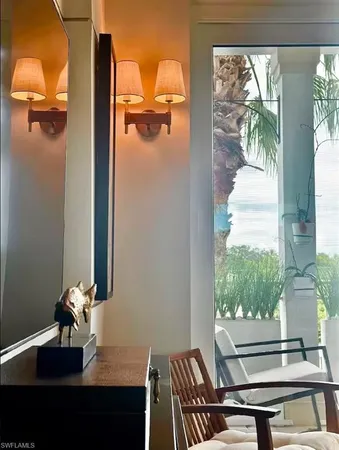 a view of a room with a window and lake view