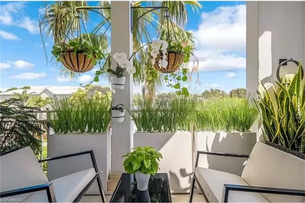 a view of outdoor space with a garden and seating area