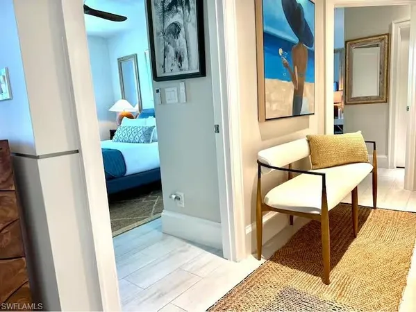 a bedroom with a bed and a chair