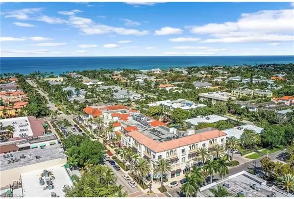 an aerial view of residential building and car parked