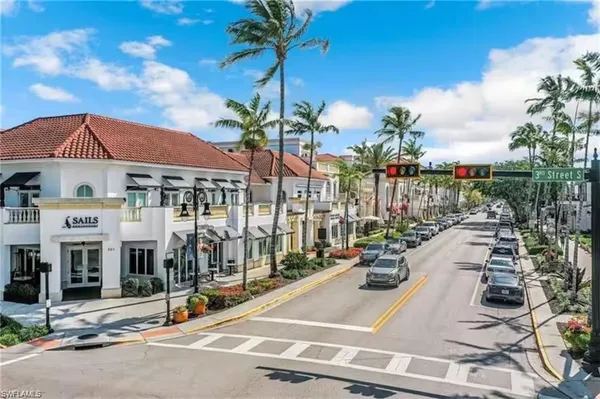 a view of multiple houses with a street