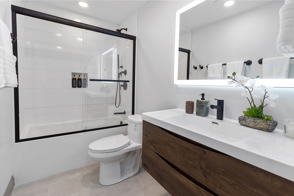 4 Snelling Place, Unit 4 Boston, MA 02113 - Photo 15 of 15 a bathroom with a sink a toilet and shower