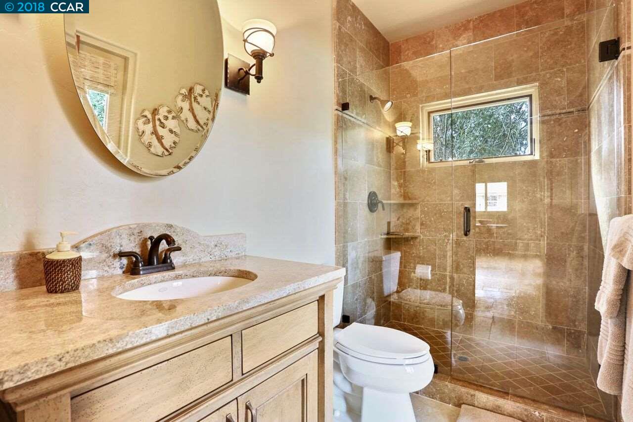 300 Eagle Drive Murphys, CA 95247 - Photo 13 of 40 a bathroom with a sink a toilet and a mirror