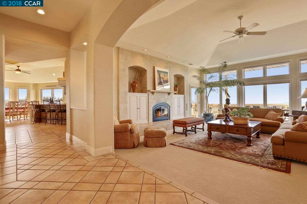 300 Eagle Drive Murphys, CA 95247 - Photo 15 of 40 a living room with fireplace furniture and a large window