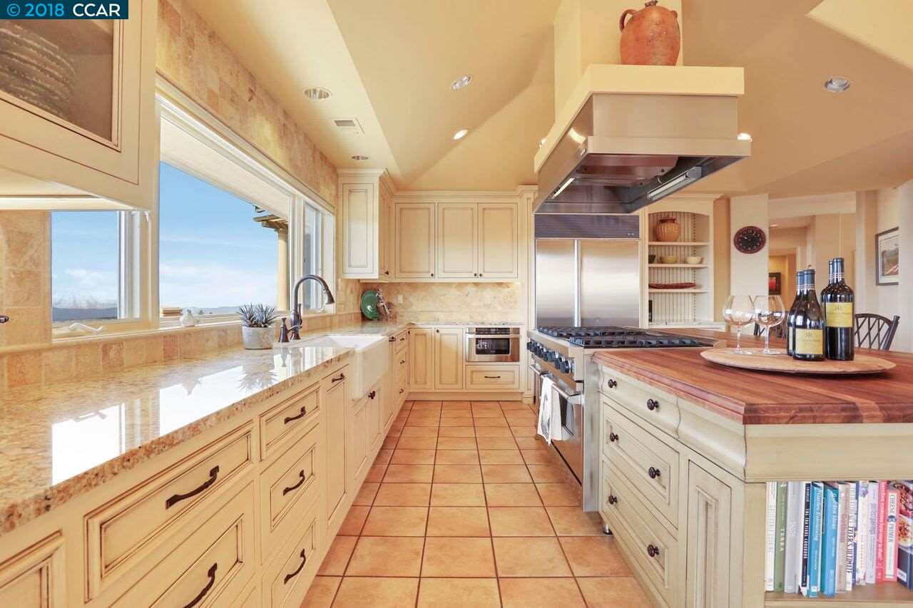 300 Eagle Drive Murphys, CA 95247 - Photo 17 of 40 a large kitchen with stainless steel appliances lots of counter space and a sink