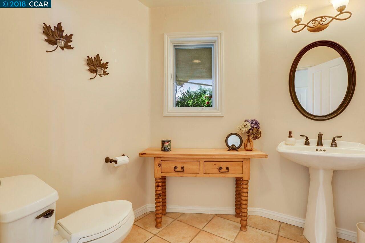 300 Eagle Drive Murphys, CA 95247 - Photo 20 of 40 a bathroom with a sink a toilet and mirror
