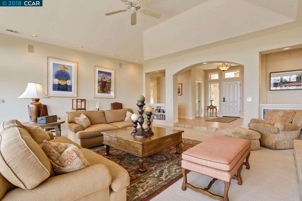 300 Eagle Drive Murphys, CA 95247 - Photo 21 of 40 a living room with furniture and a large mirror